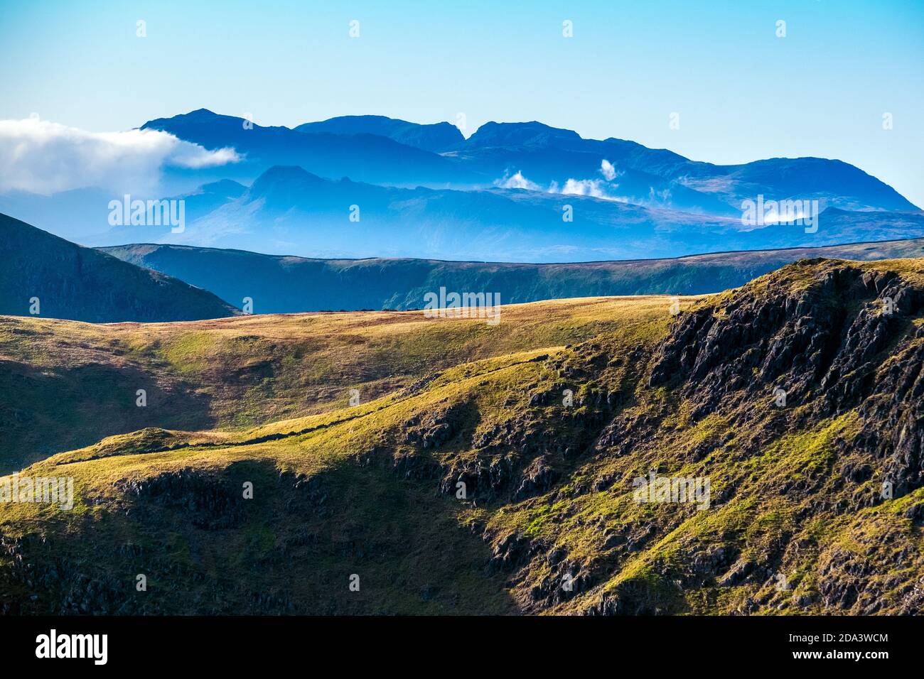 View from High Street across the central Lake District fells. Bowfell, Scafell and Scafell Pike in the distance Stock Photo
