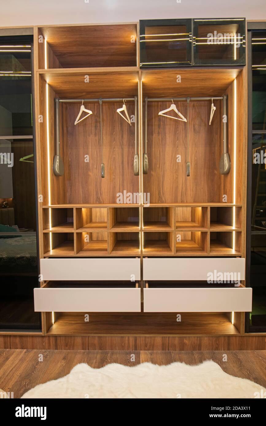 Interior design decor furnishing of luxury show home bedroom showing wooden  wardrobe closet furniture Stock Photo - Alamy
