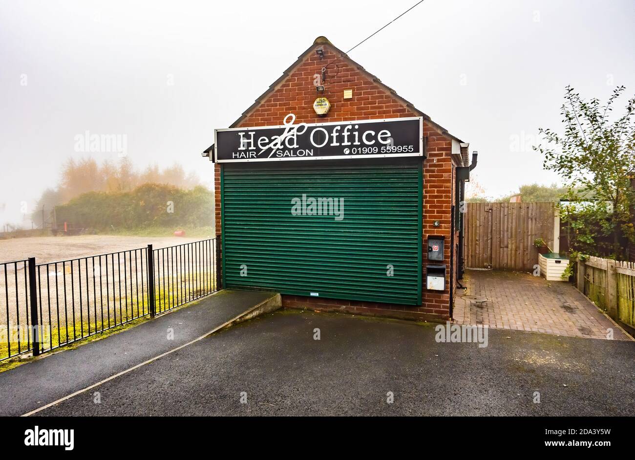 Hair salon closed down with closed shutters Stock Photo Alamy