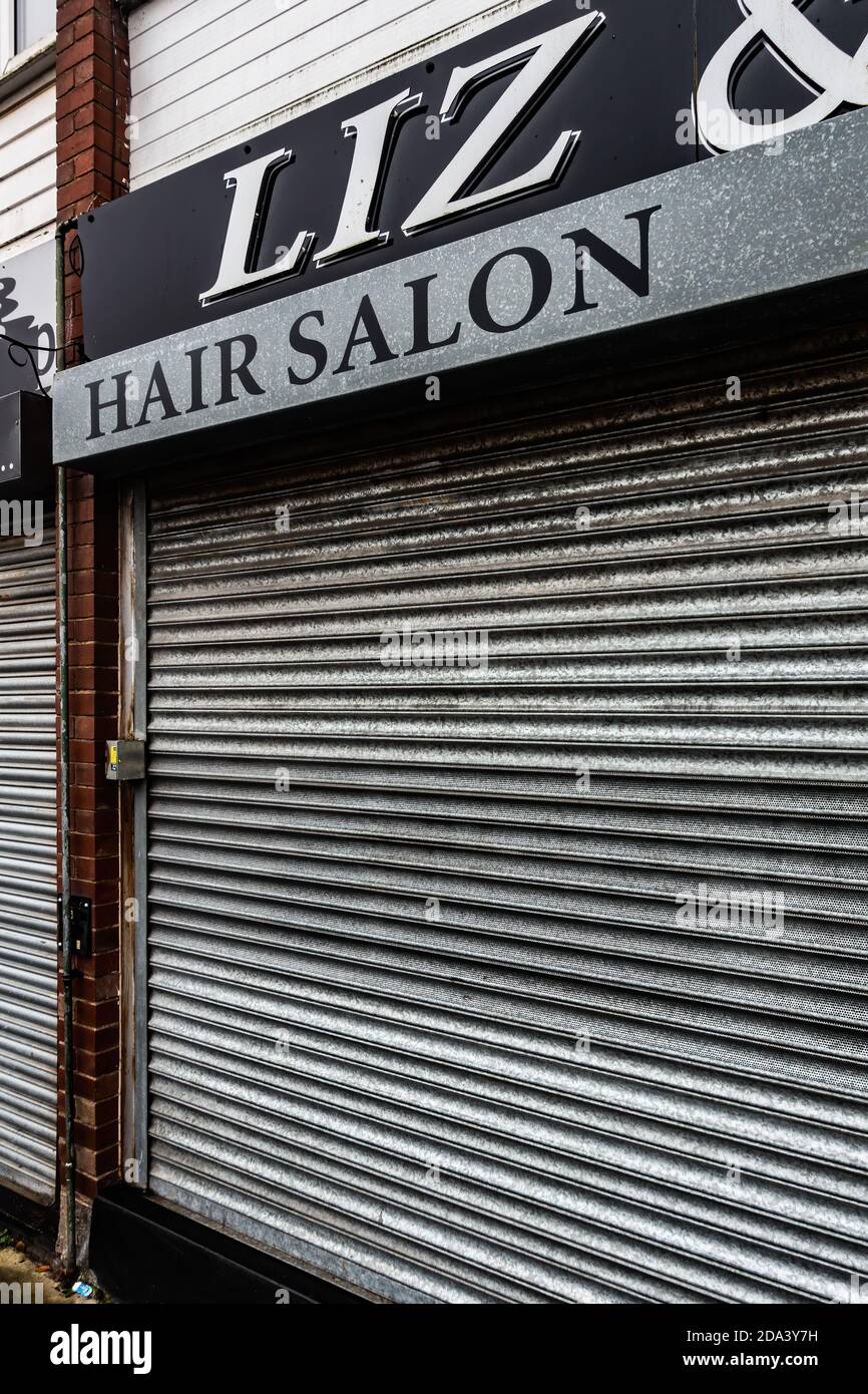 Hair salon closed down with closed shutters Stock Photo Alamy