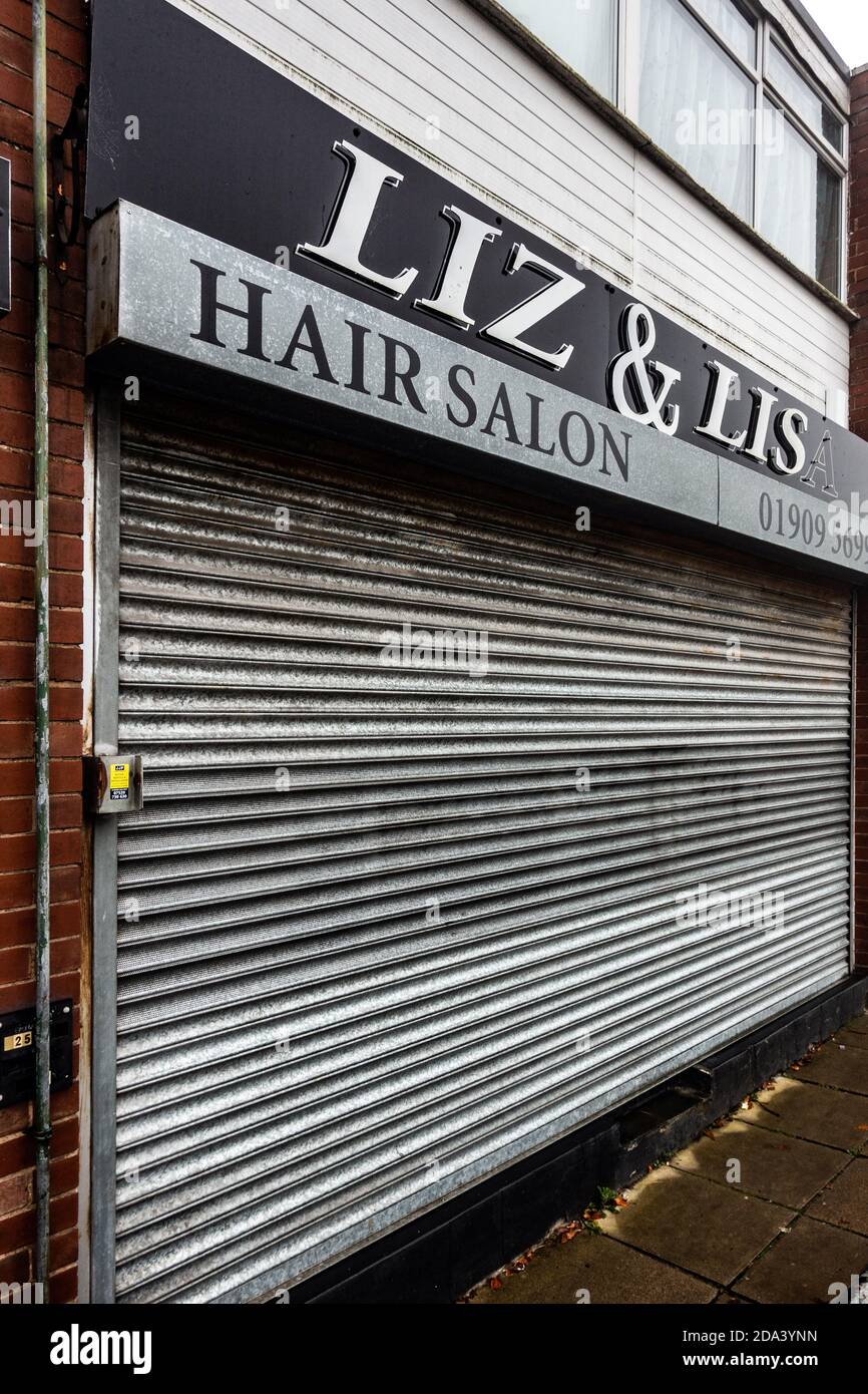 Hair salon closed down with closed shutters Stock Photo Alamy