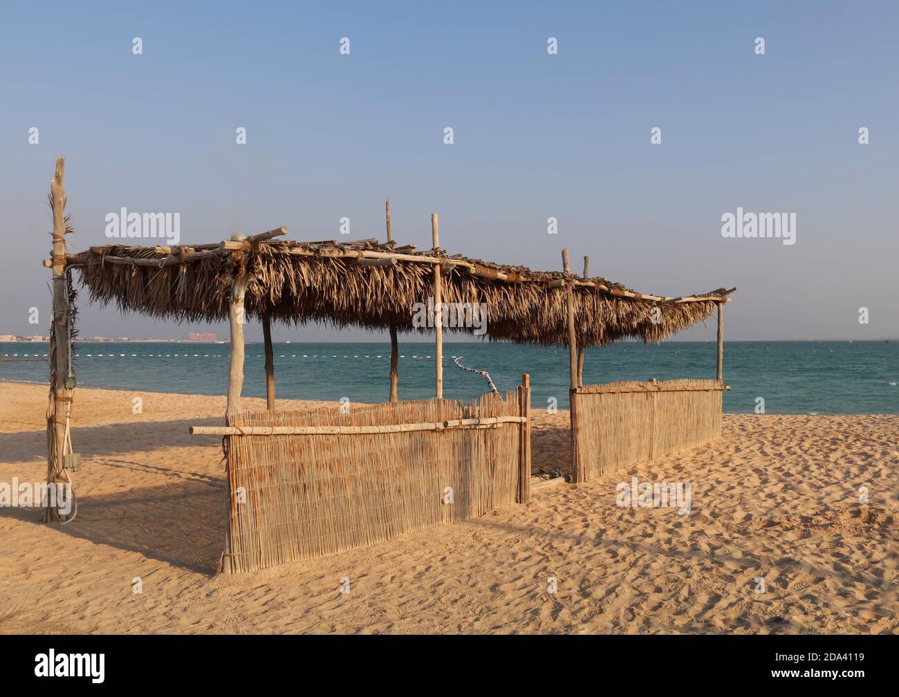A palm shed on a beach in Doha Qatar. Stock Photo