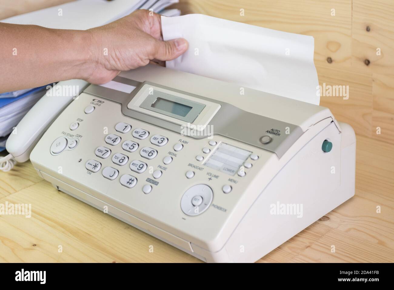 hand man are using a fax machine in the office, equipment for data