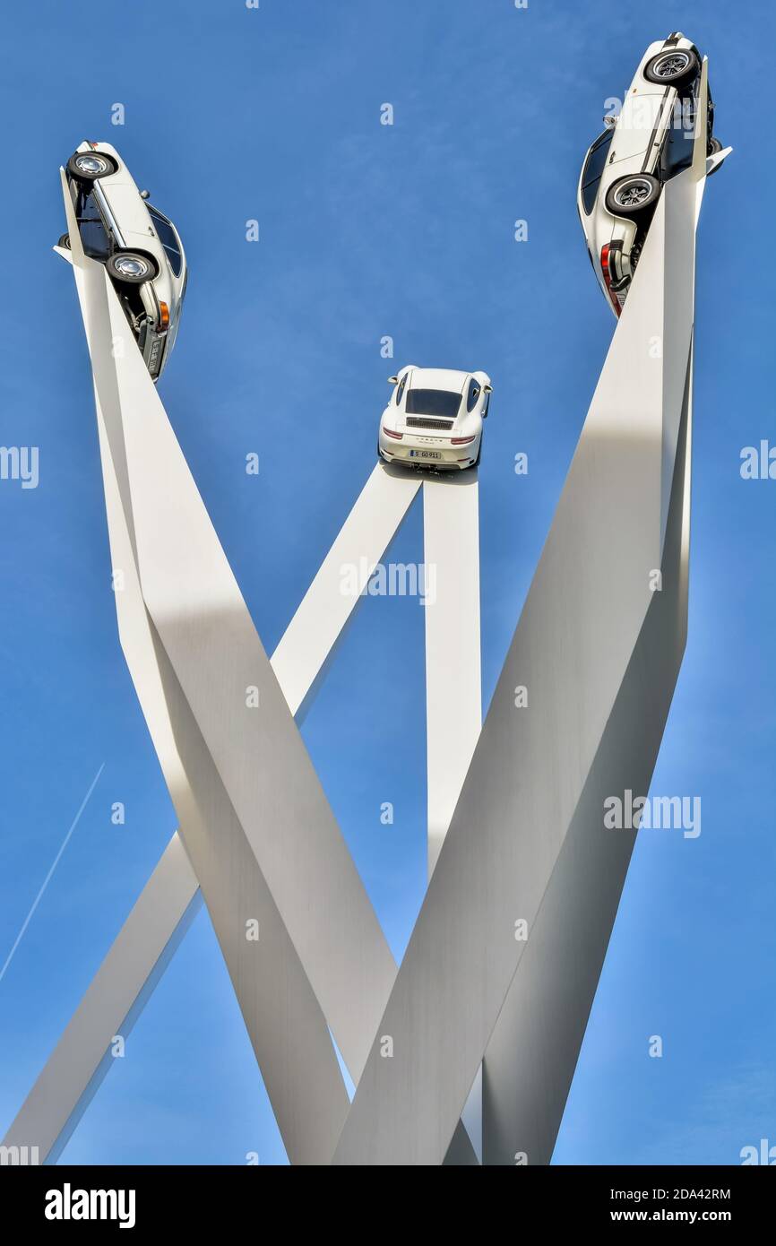 Stuttgart, Germany – January 24, 2018. Installation with three Porsche cars on top, in front of the Porsche Museum in Stuttgart. Stock Photo