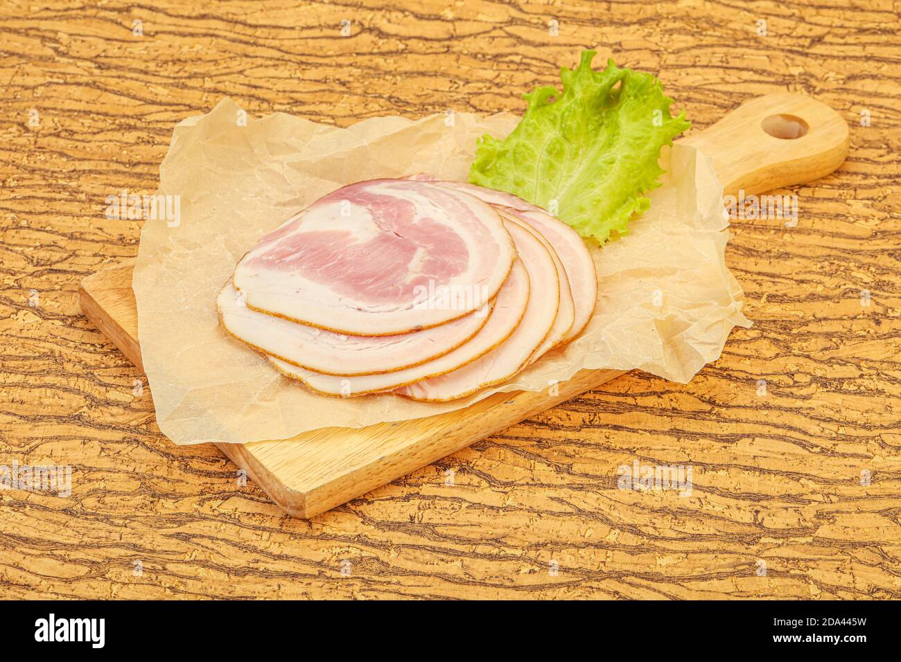 Sliced Italian Pancetta sausage over board Stock Photo Alamy