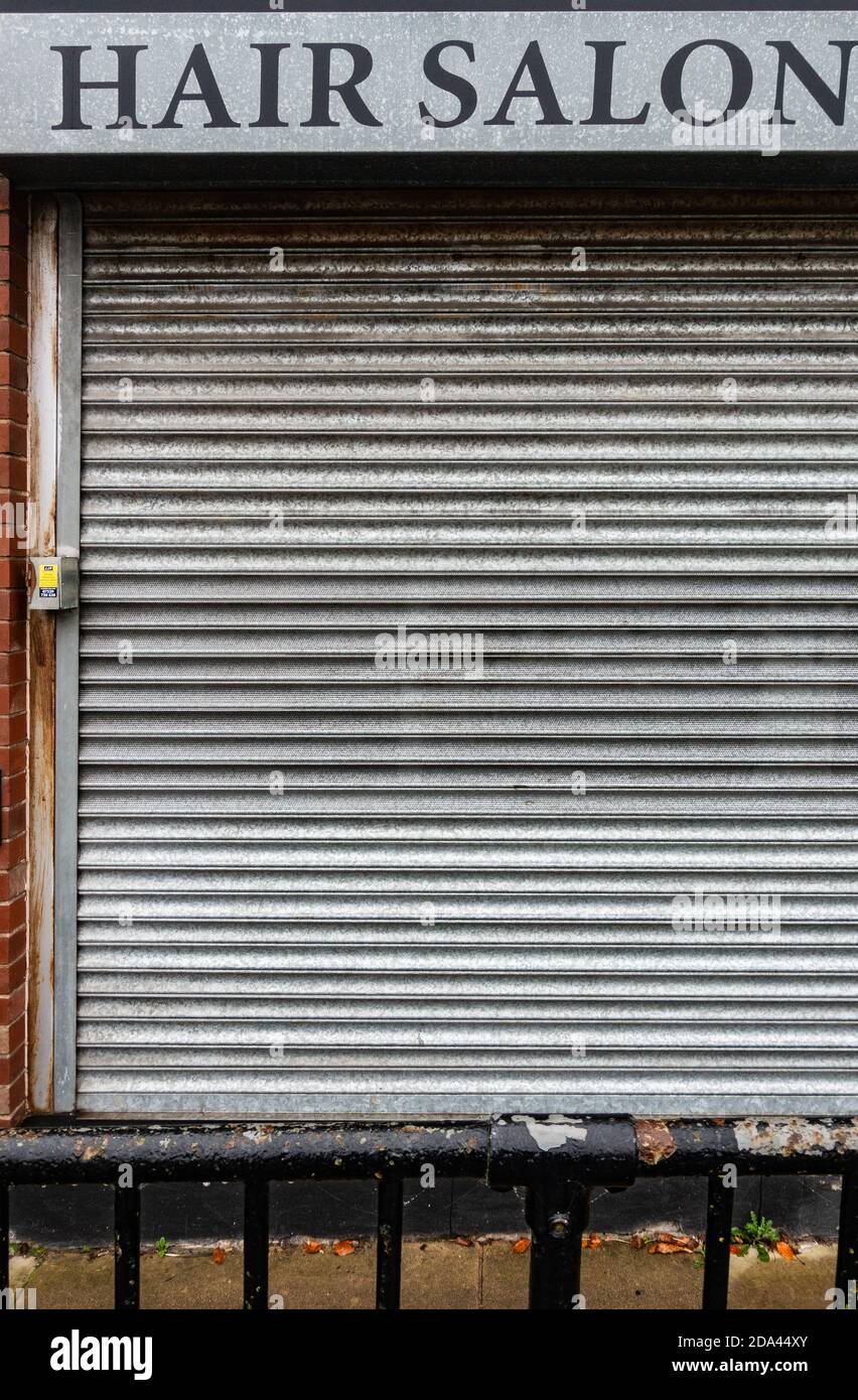Hair salon closed down with closed shutters Stock Photo Alamy