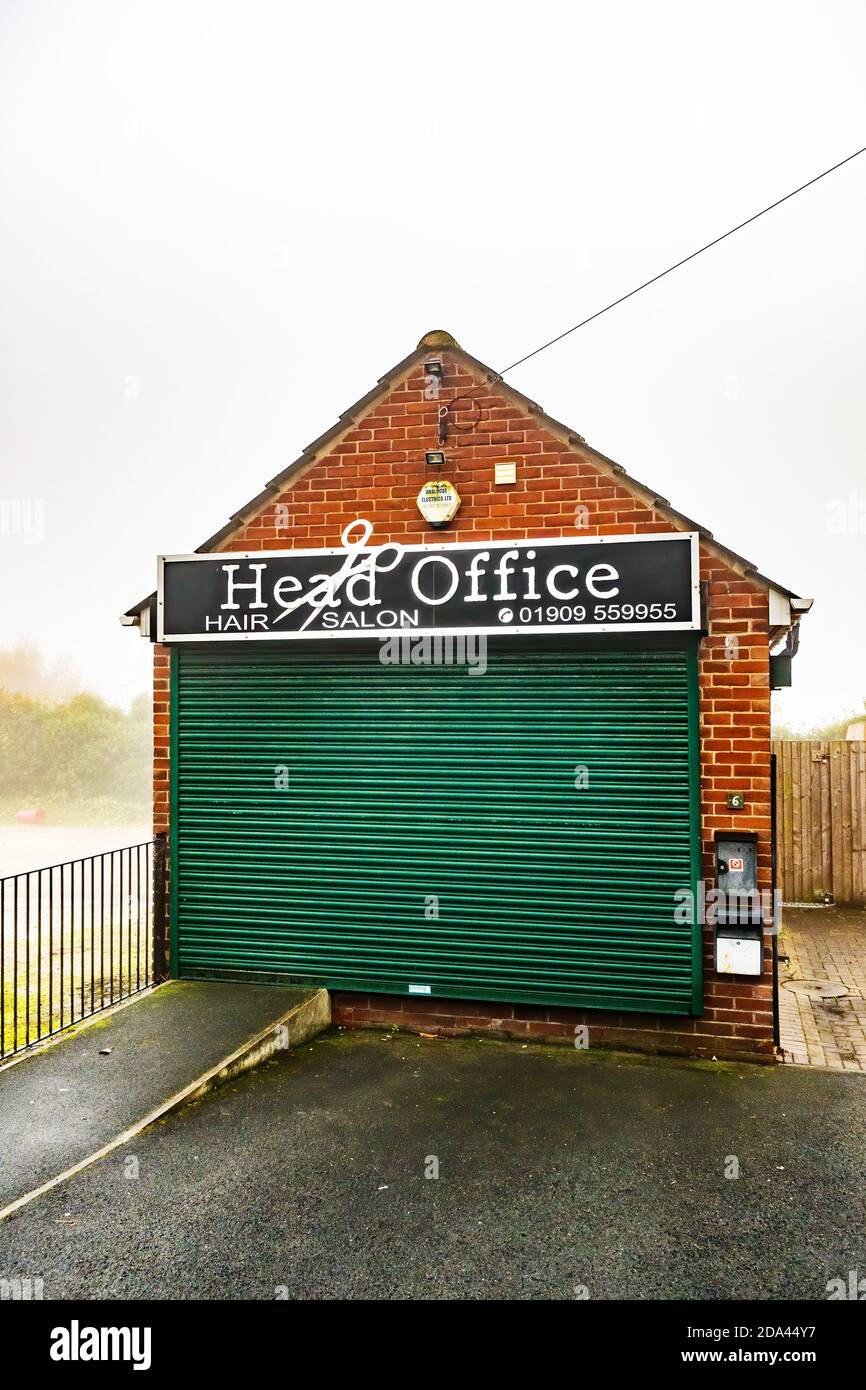 Hair salon closed down with closed shutters Stock Photo Alamy