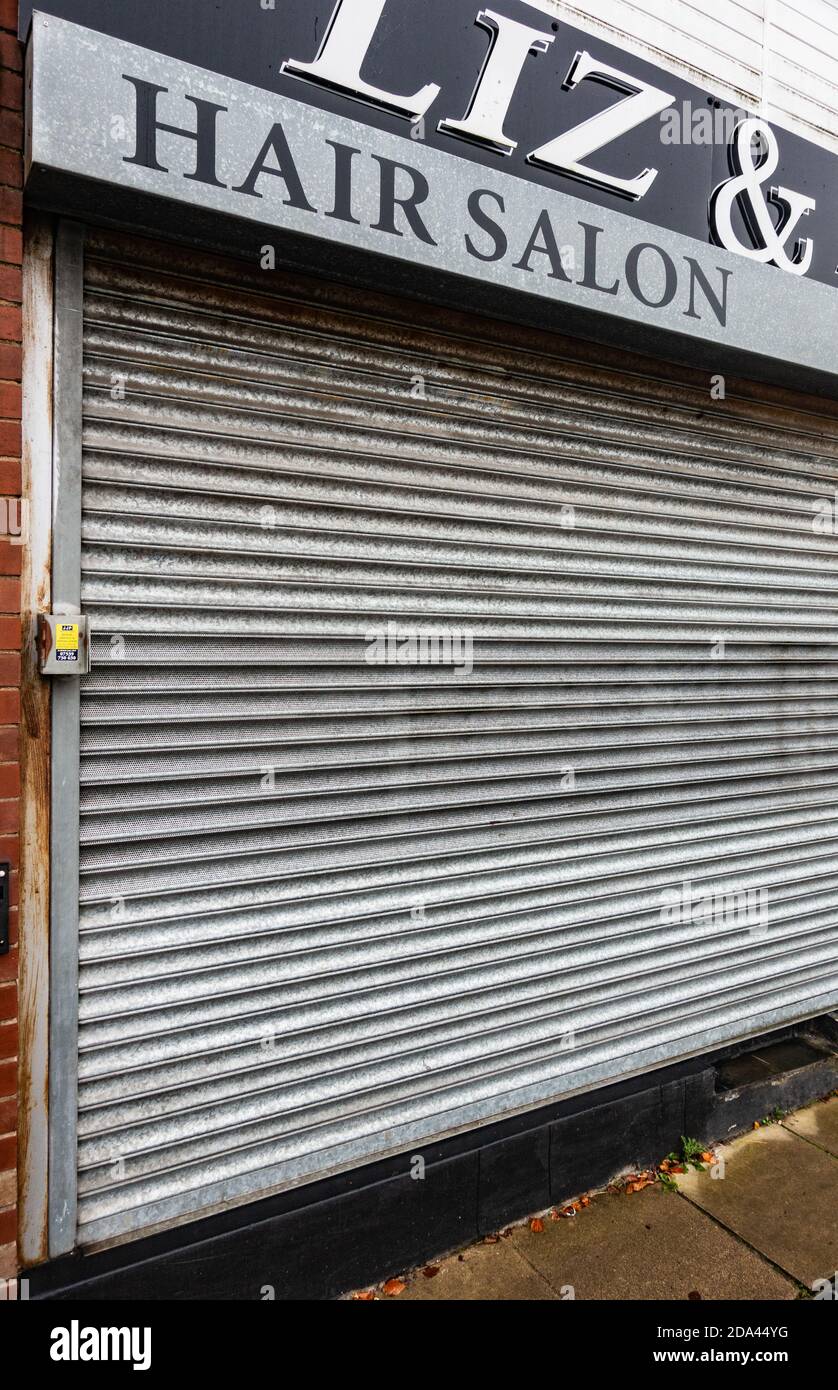 Hair salon closed down with closed shutters Stock Photo Alamy