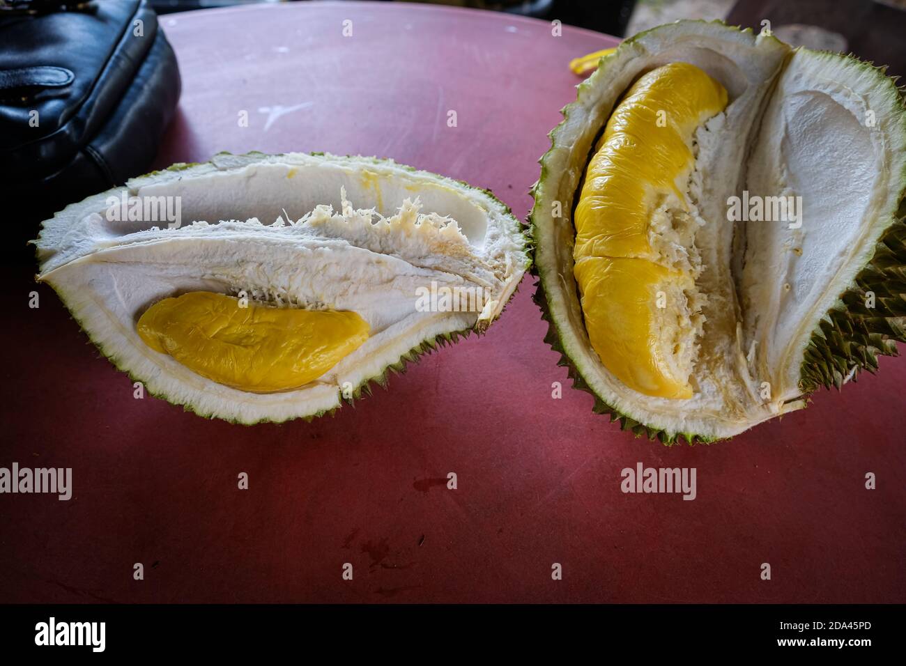 Closed up shot of The Musang King durian, also known by its original name Raja  Kunyit, has deep yellow flesh, broad and blunt spikes, a gap between th  Stock Photo - Alamy