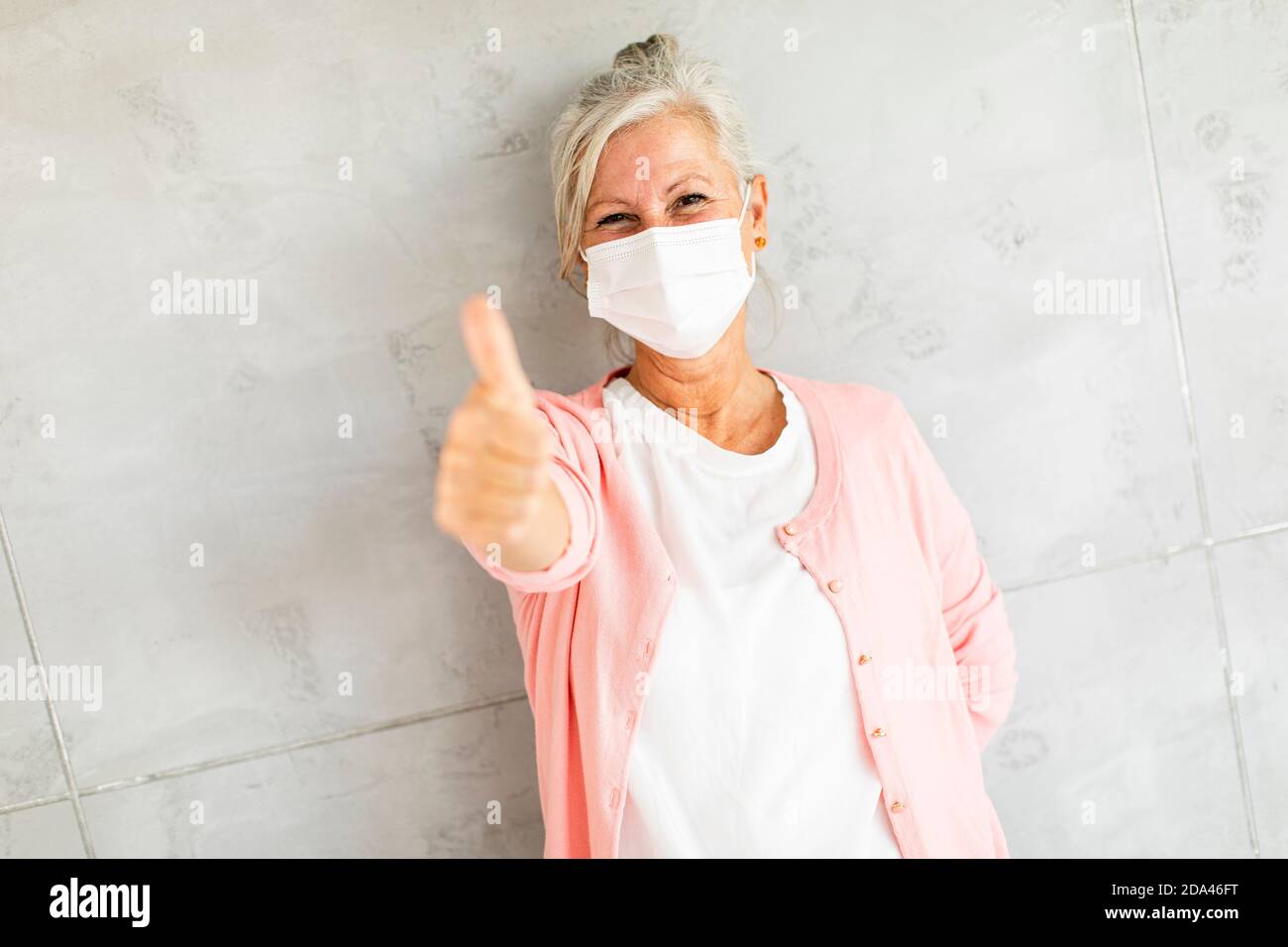 Mature woman wearing facial mask hi-res stock photography and images ...