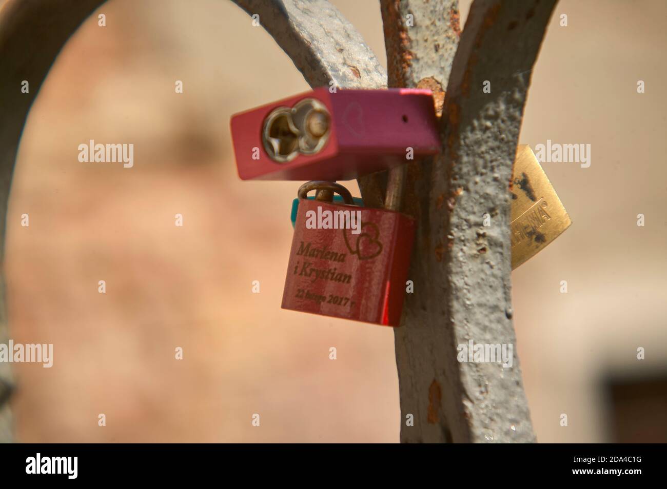 Padlocks with names attached to the bridges of a bridge as a symbol of couple love among boys