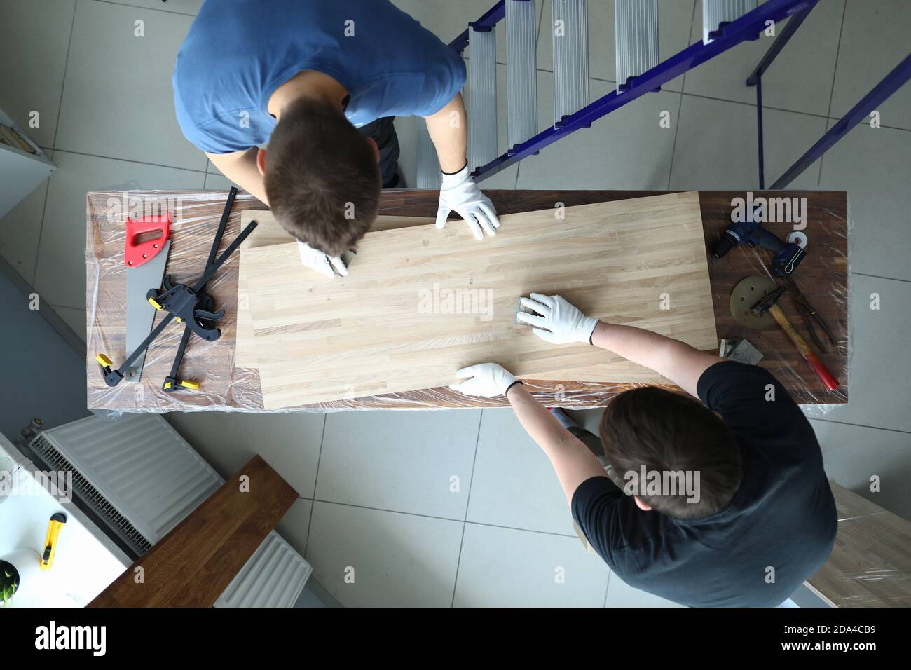 Woodworkers in uniform at workplace Stock Photo