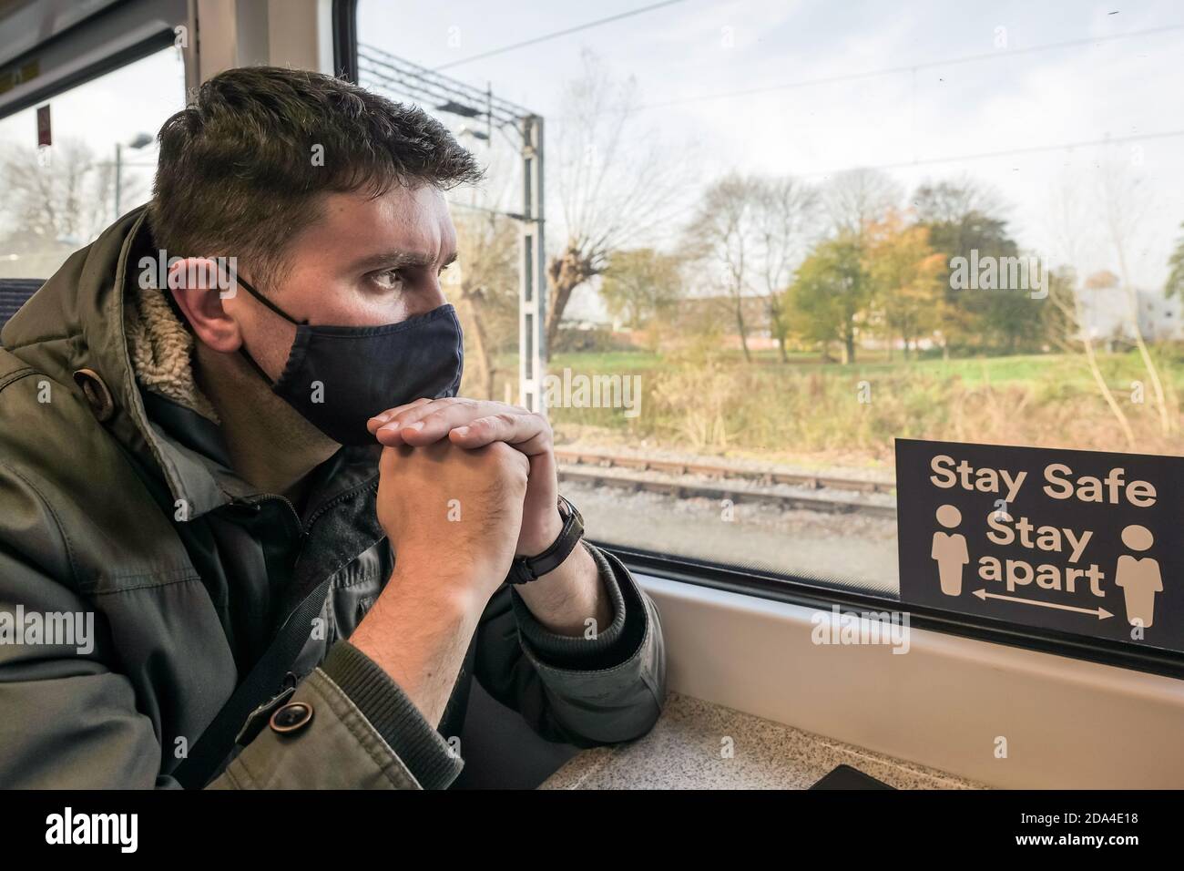 male passenger wearing face covering mask during covid19 lockdown