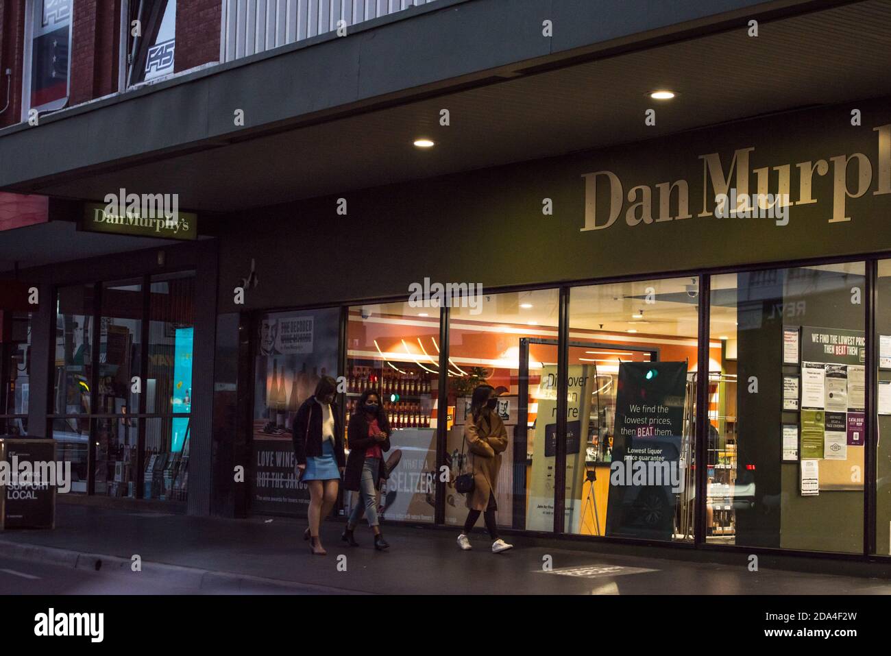 Prahran, Australia. 07th Nov, 2020. A group of young adults walk by