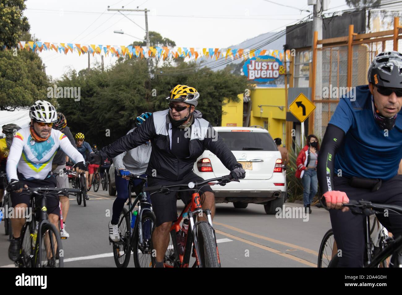 LA CALERA COLOMBIA - OCTOBER, 2020: Group of amateur cyclists arriving to the well known Alto de Patios on the road between Bogota and La Calera on th Stock Photo