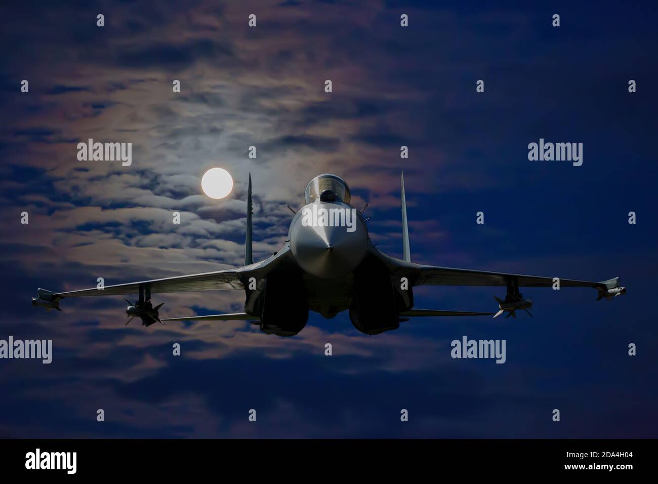 Russian military aircraft in the sky on a moonlit night Stock Photo