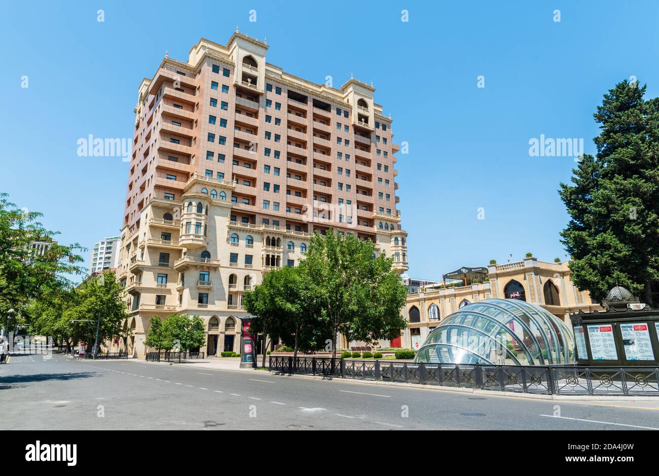Baku, Azerbaijan – July 5, 2020. View of Samad Vurgun street in downtown Baku, toward Fizuli Square. View with a huge modern building and commercial p Stock Photo