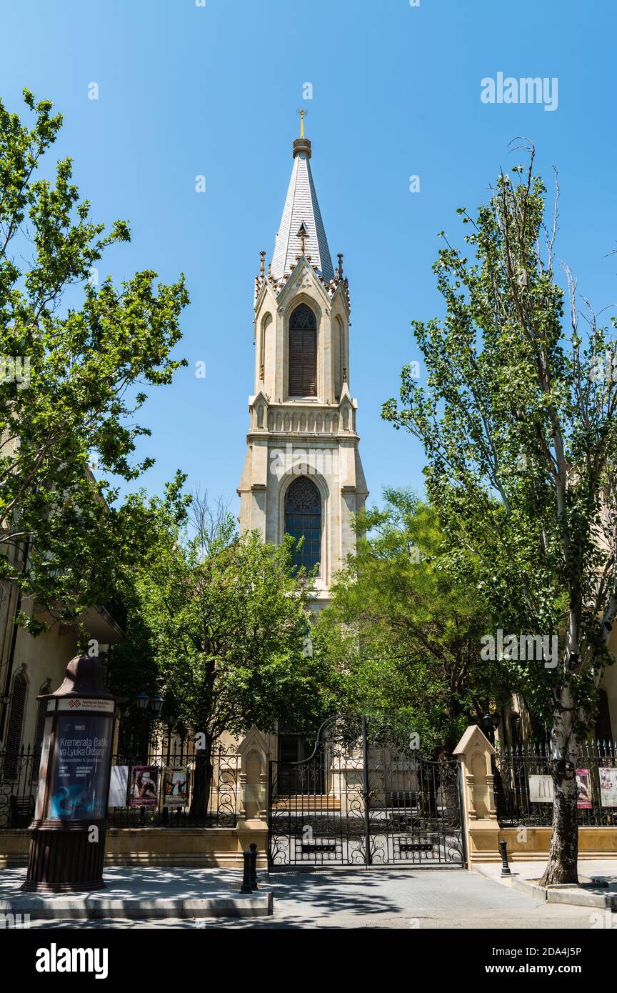 Baku, Azerbaijan – July 5, 2020.  A spired German Lutheran church Kirche, dating from 1899, on 28th May Street in Baku. Stock Photo