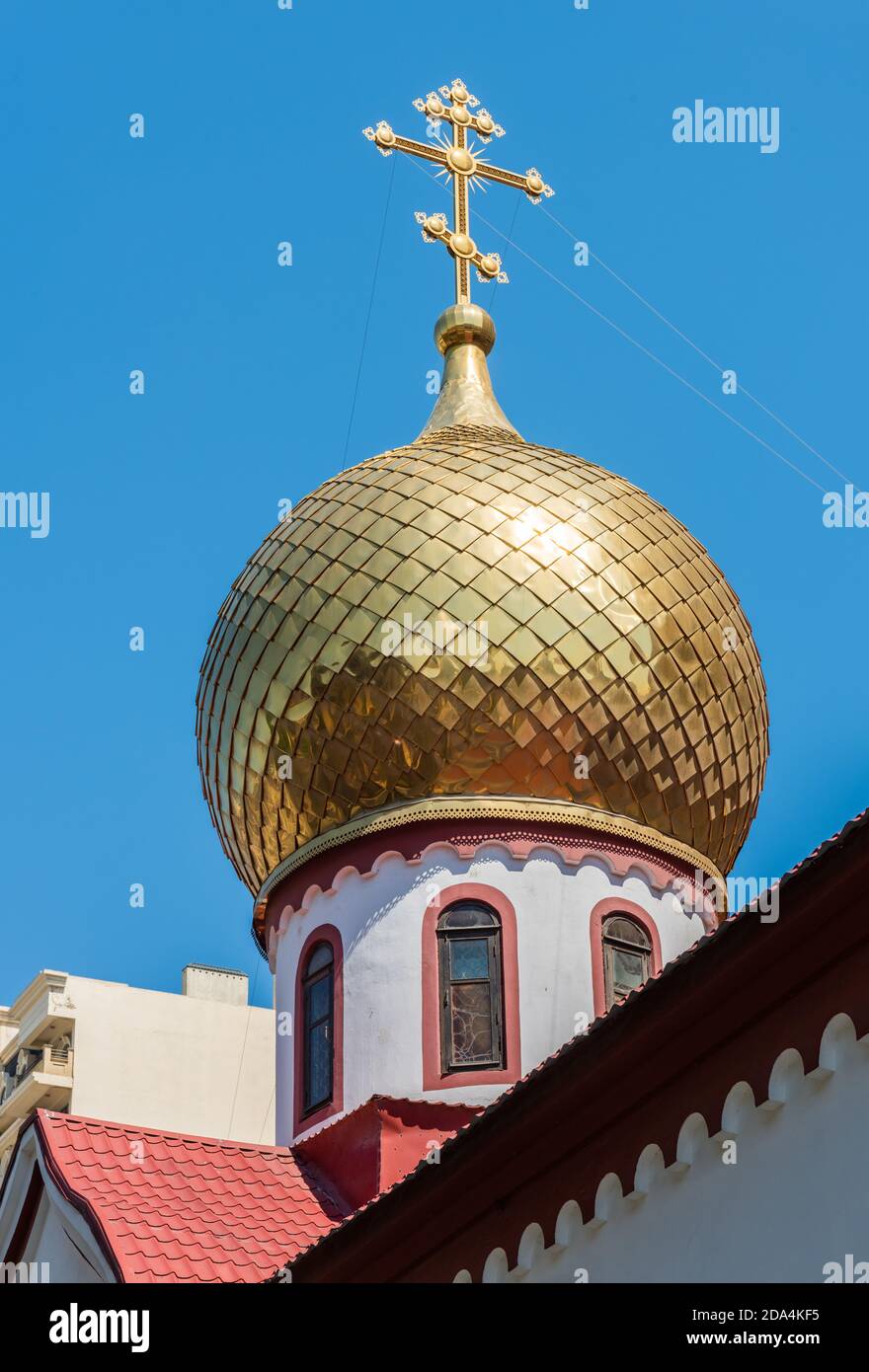 Baku, Azerbaijan – July 26, 2020. Onion dome and cross of Archangel Michael Orthodox Church in Baku. The building dates from 1850. Stock Photo