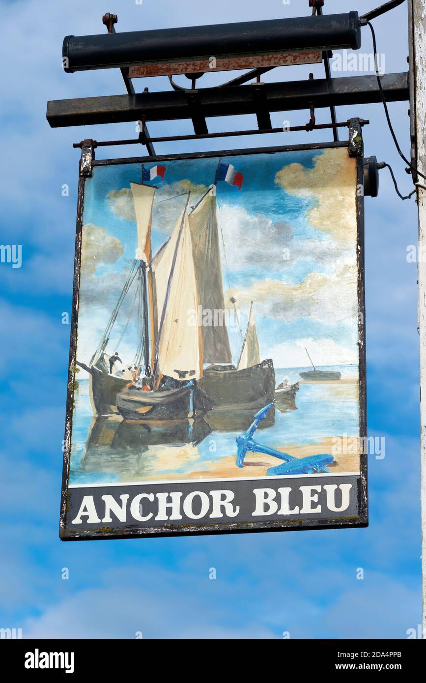 Pub sign for the waterside 'Anchor Blue' pub on the High Street in the historic Chichester Harbour village of Bosham, West Sussex, England, UK Stock Photo