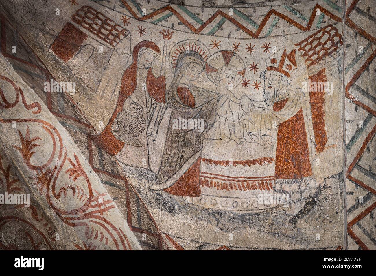 Mary hands over baby Jesus to the priest Simeon, ancient fresco in Tuse church, Denmark, July 16, 2020 Stock Photo