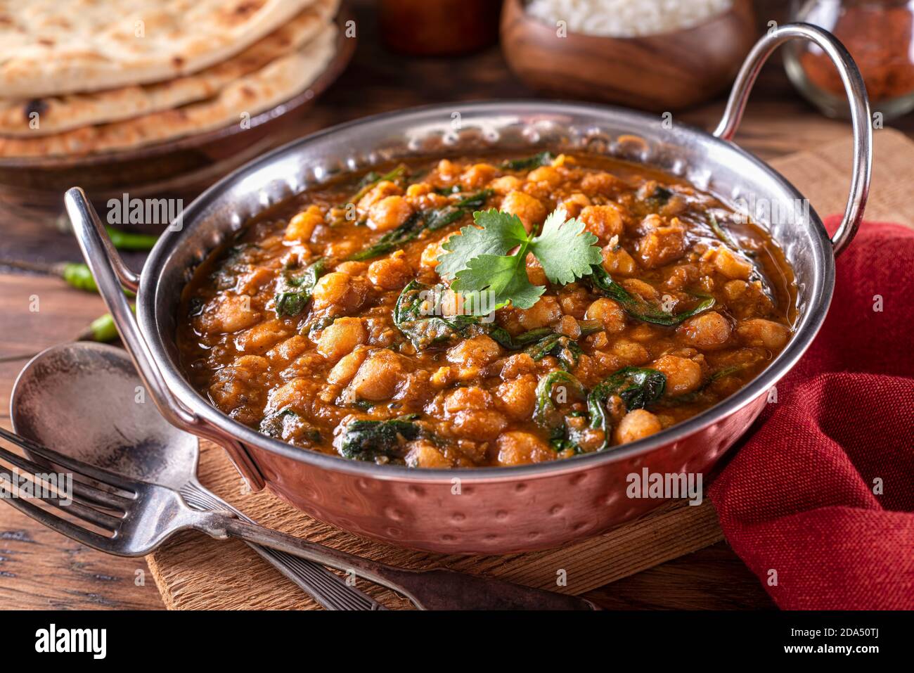 A bowl of delicious chickpea curry with spinach channa masala. Stock Photo