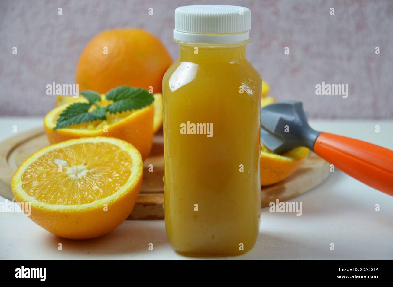 Bottle of orange juice shot. orange organic freshly squeezed juice in a