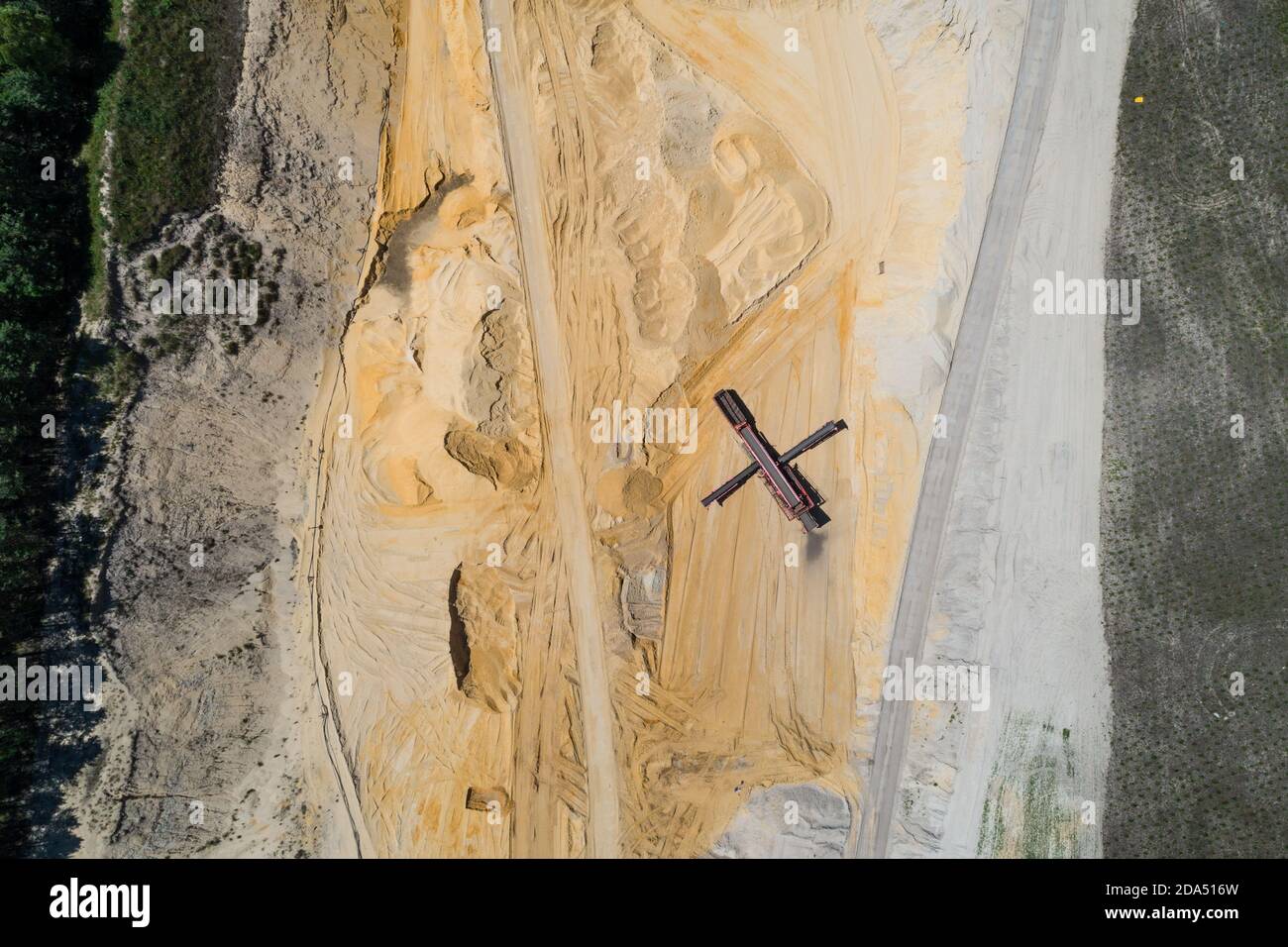 Sand pit quarry with big excavator, digger. Heavy machinery industry in Europe, Poland. Ecology and environmental. Aerial drone photo View Stock Photo