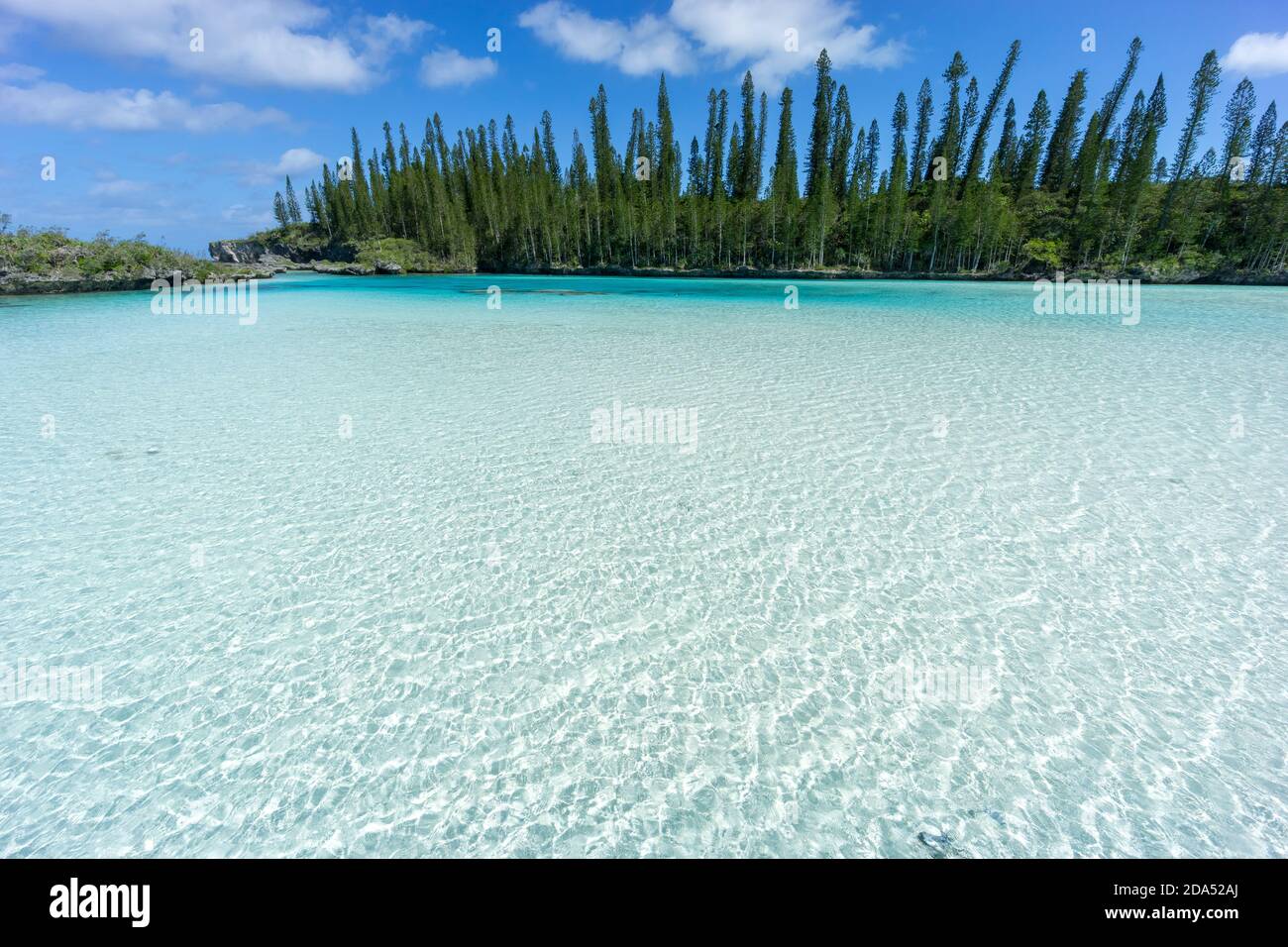 beautiful seascape of natural swimming pool of Oro Bay, Isle of Pines, New Caledonia. aquamarine translucent water. Stock Photo