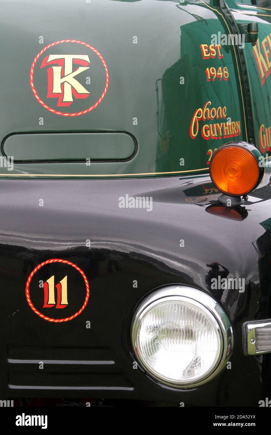 Number, various, on wall, clocks, signs , advertising , vehicles. The