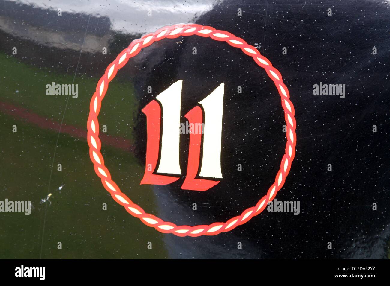 Number, various, on wall, clocks, signs , advertising , vehicles. The