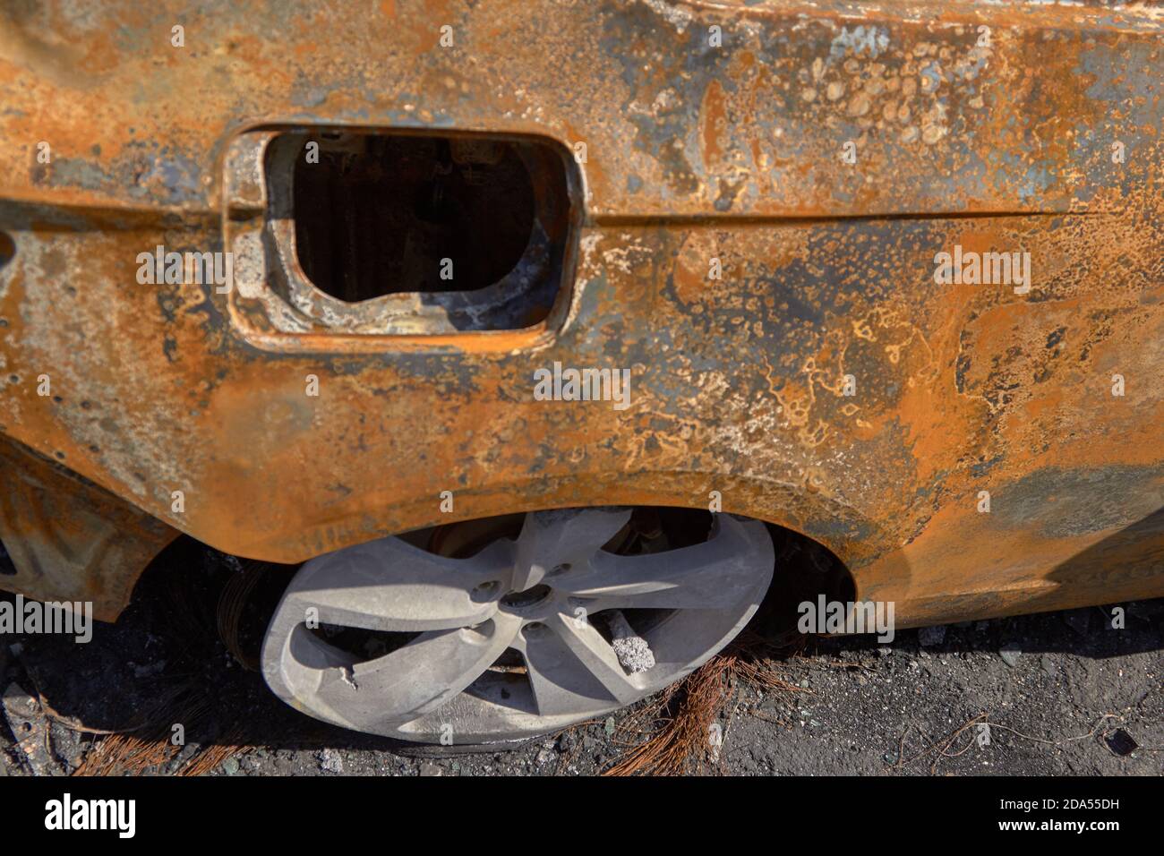 wheels and wheels of a burned-out car in one of the city's districts ...