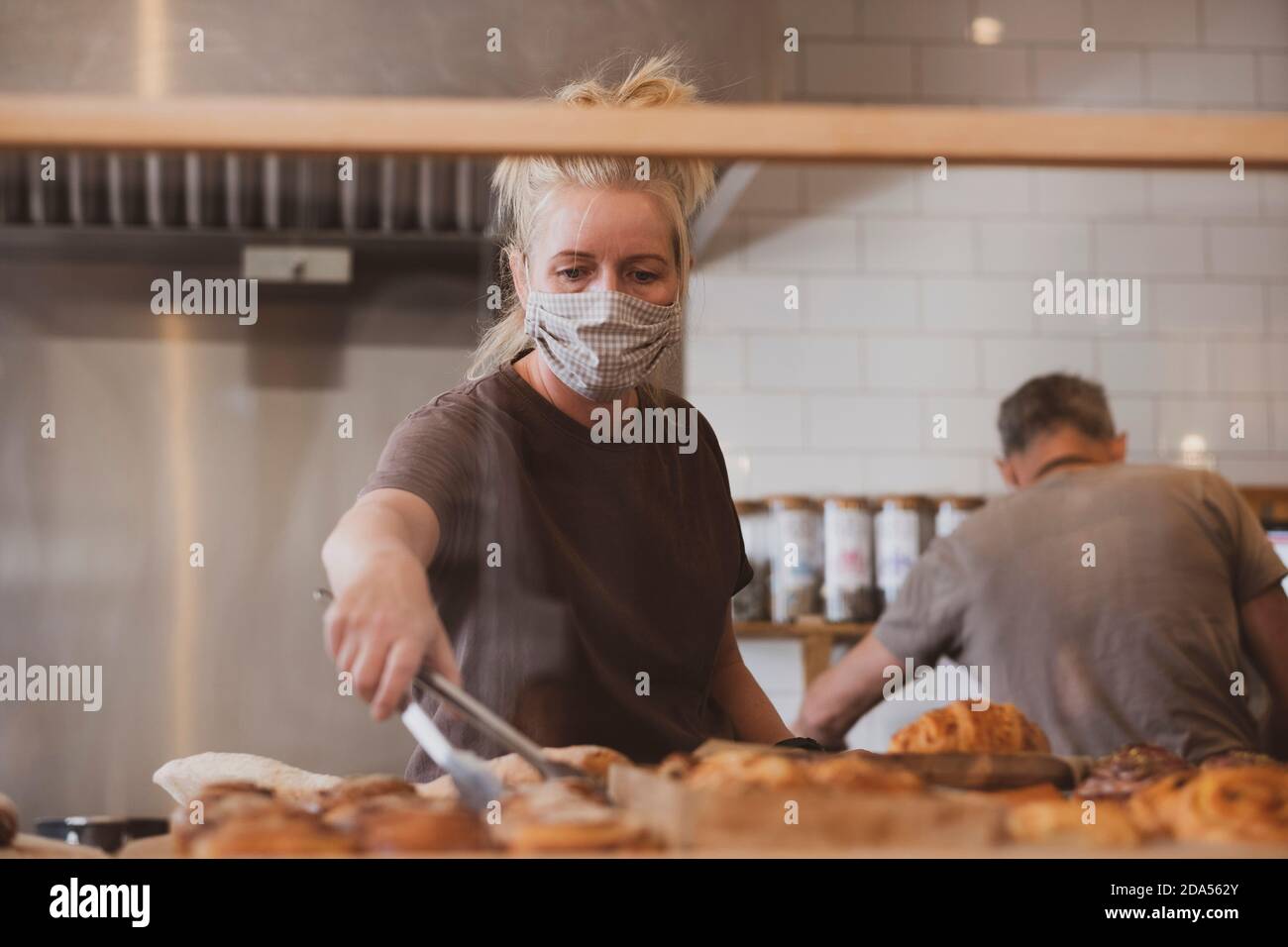 Waitress wearing mask holding hi-res stock photography and images - Alamy