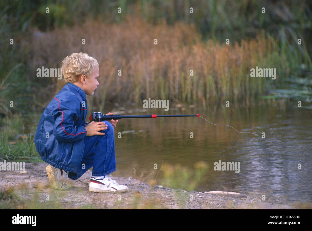6 YEAR OLD BOY FISHING / PENNSYLVANIA Stock Photo