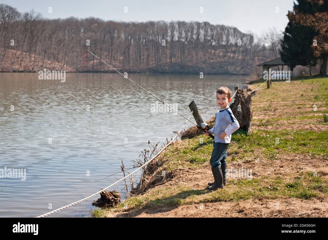 YOUNG BOY FISHING AT SPEEDWELL FORGE LAKE, LANCASTER COUNTY, PENNSYLVANIA Stock Photo