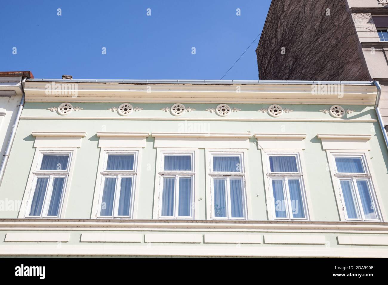 Typical Austro-Hungarian Facade of an appartment residential building in a street of old town, stari grad,, the historical center of Belgrade, Serbia, Stock Photo