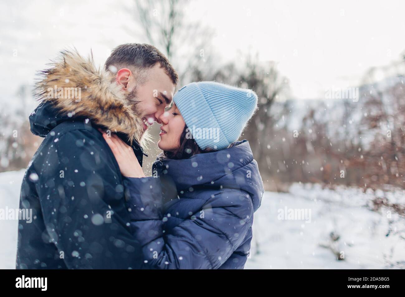 Couple Enjoying Snowfall High Resolution Stock Photography And Images Alamy