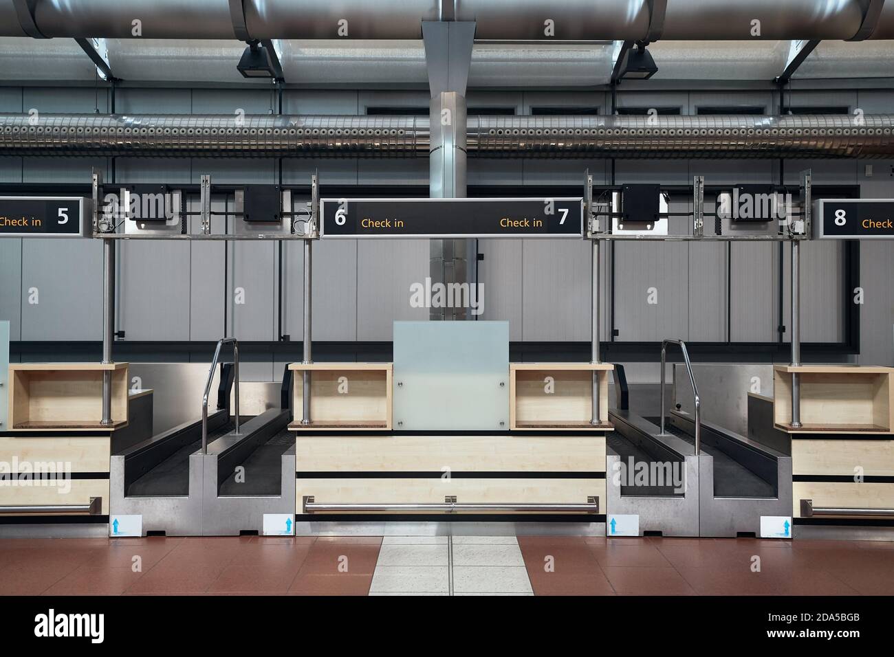 Checkin counters and baggage conveyors at an airport Stock Photo Alamy