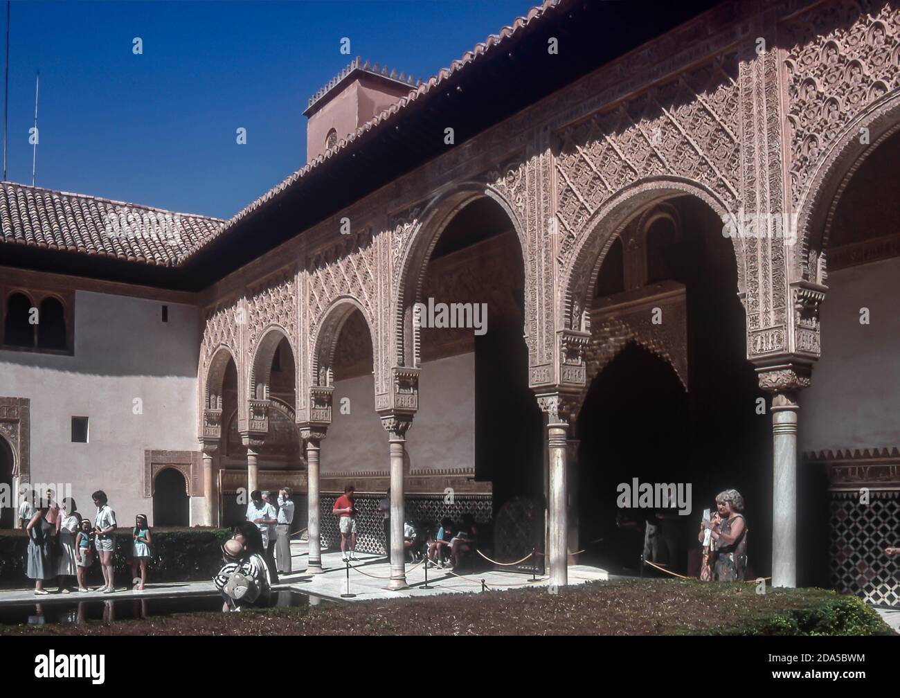 Tourists in the courtyard of the Palacio Nazaries in the Alhambra in Granada, Spain, Europe Stock Photo