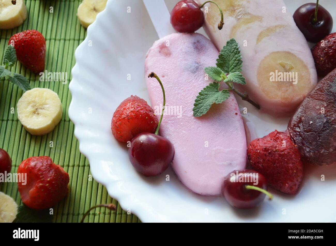 Homemade strawberry cherry banana blueberry ice cream or popsicles
