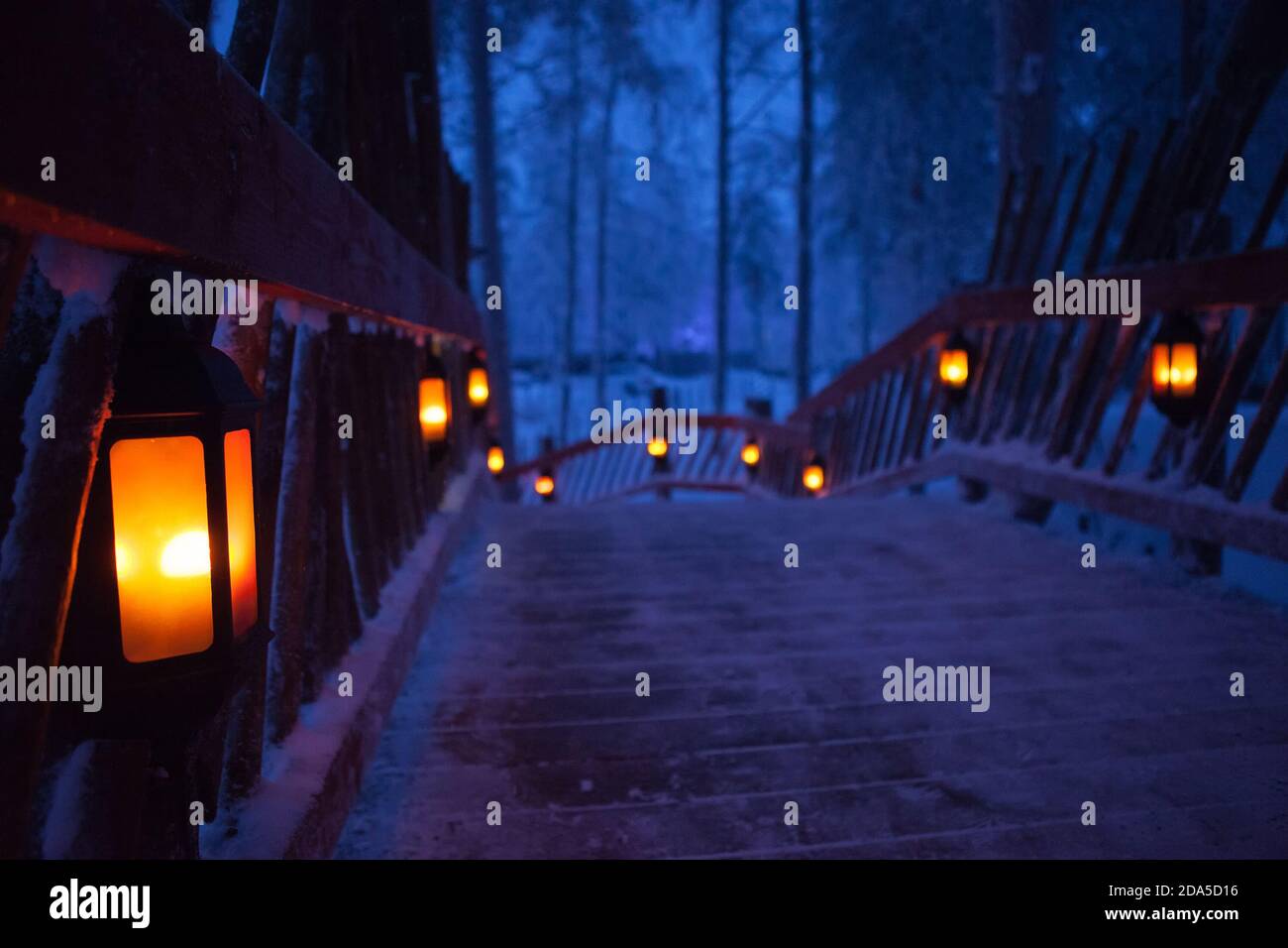 Santa claus village lapland finland. beautiful wooden bridge with lanterns Stock Photo