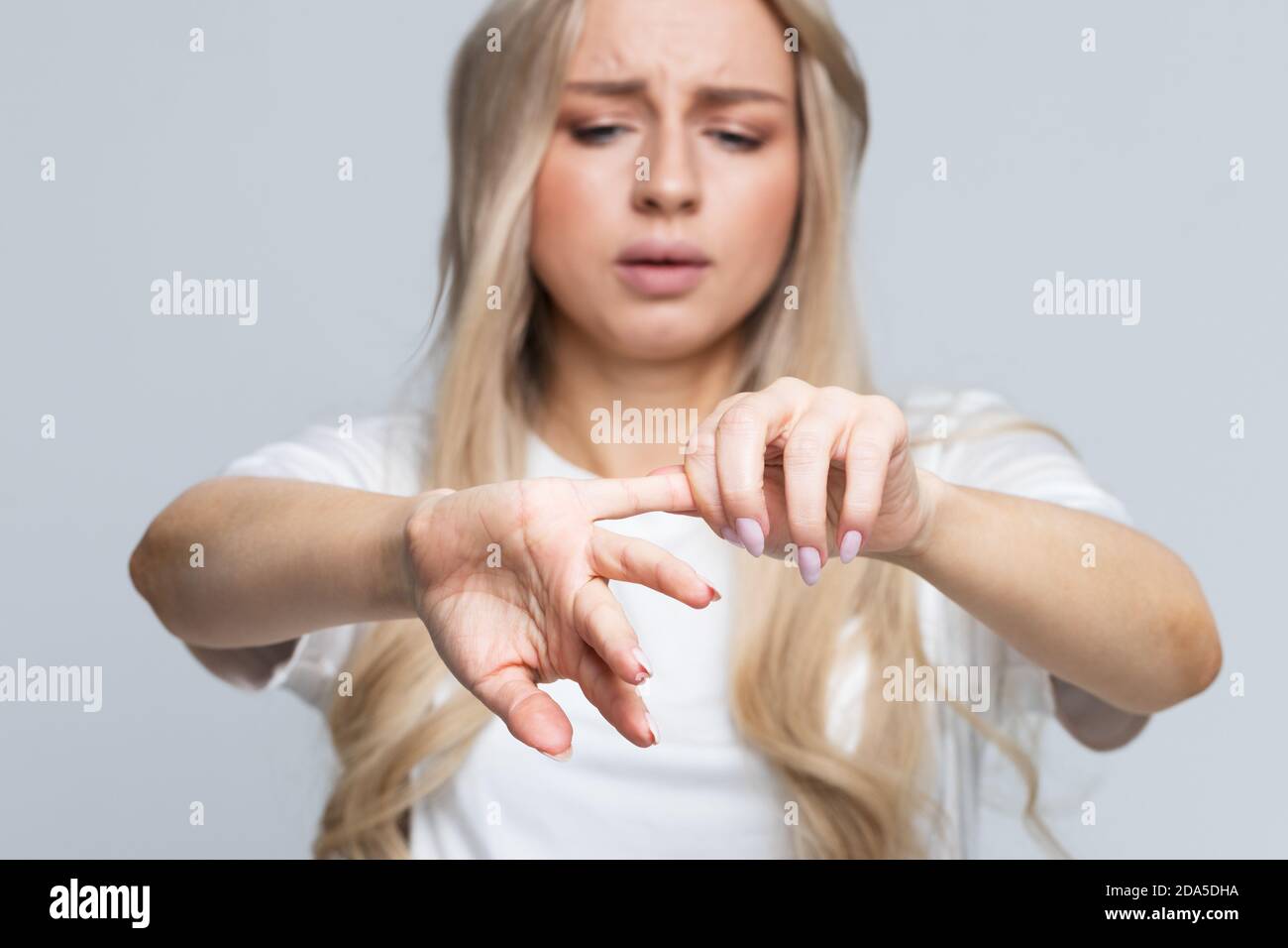Woman having finger pain, stretching exercises and massage for fingers