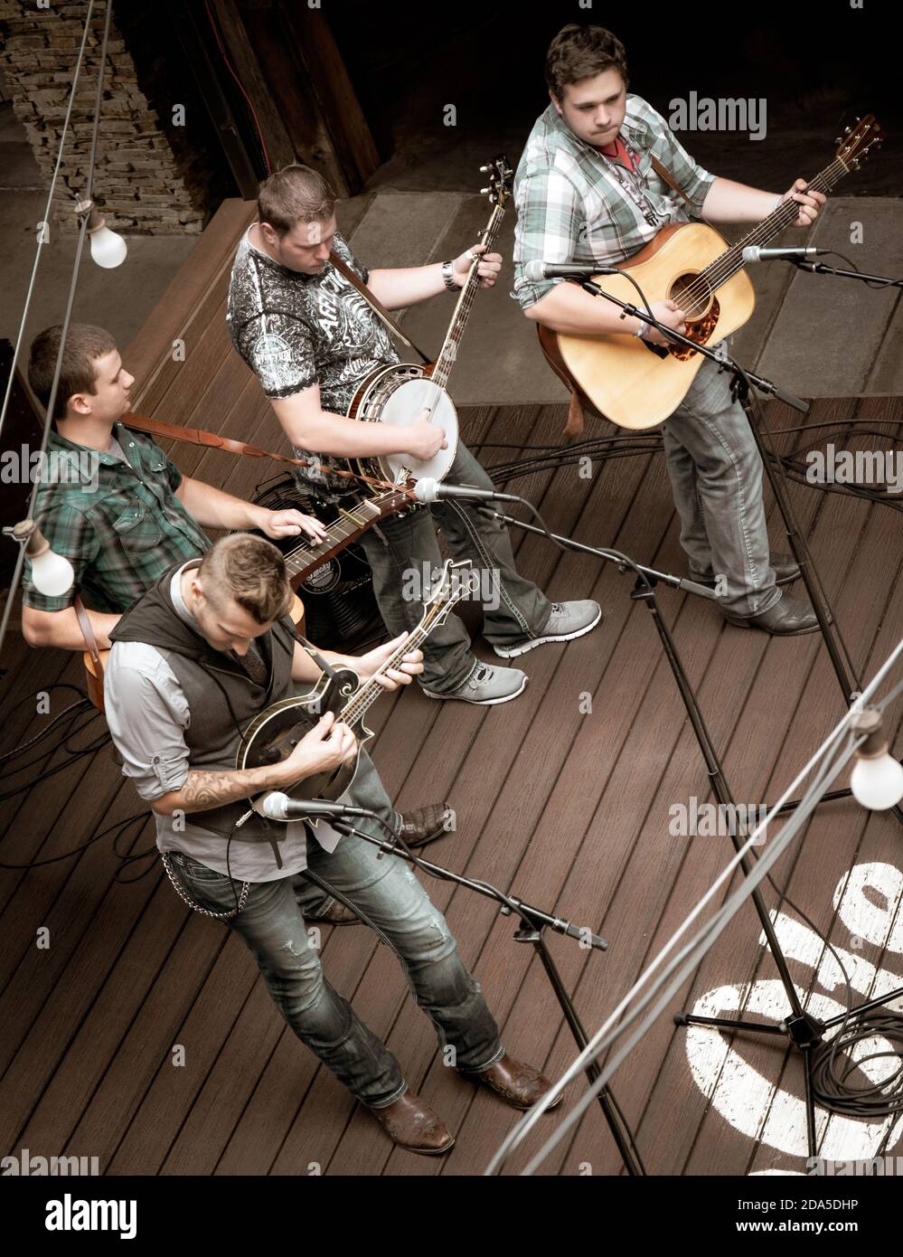Overhead view of modern Blue grass band,  'Monroeville' playing a concert on stage at the Ole Smoky Moonshine Distillery, Gatlinburg, TN Stock Photo