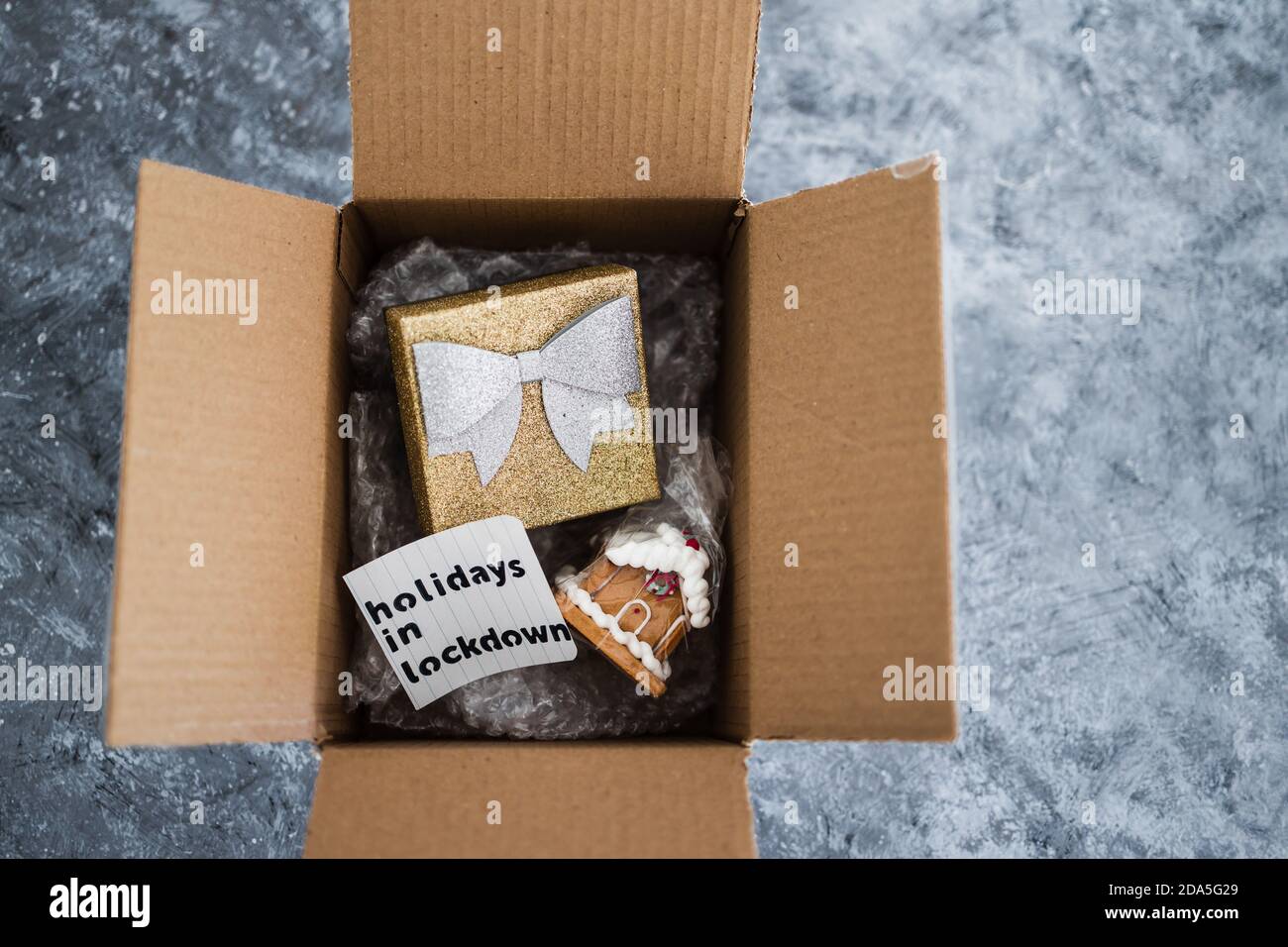 winter holidays in lockdown concept, gifts being delivered via postal