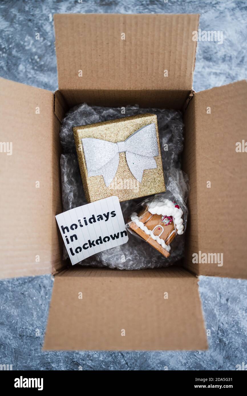 winter holidays in lockdown concept, gifts being delivered via postal