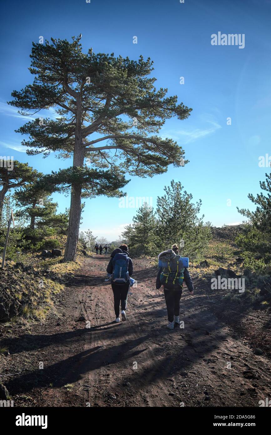 two young girls walking on a mountain path of Etna Park, Sicily Stock ...