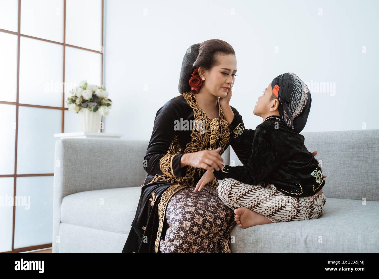 Portrait of a happy mother with her son. The Javanese concept in the ...