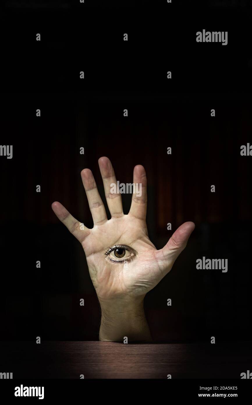 Abstract open human hand with an eye on the palm, hamsa symbol Stock Photo