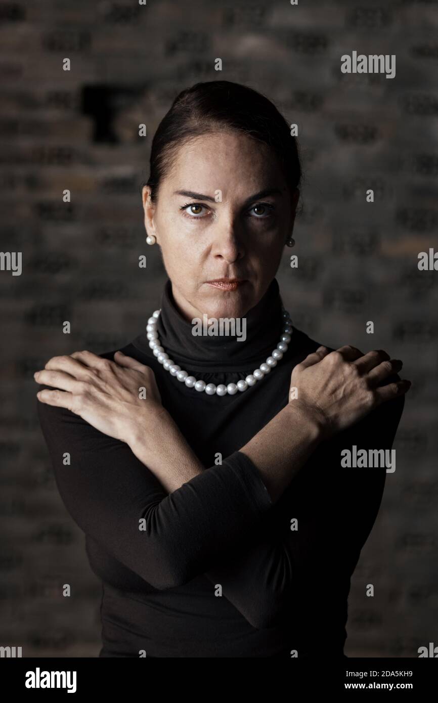 Portrait of a woman with arms crossed over her chest Stock Photo Alamy
