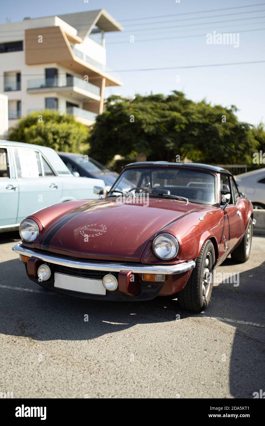 The Triumph Spitfire - British two-seat vintage sports car on a city street Stock Photo
